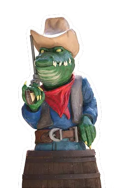 OK CORRAL offre une ambiance Far West unique avec cette statue colorée d'un cowboy crocodile, idéale pour les familles en quête de divertissement en Provence. Ce parc à thème familial dans le Sud de la France propose des attractions pour enfants, avec des décors immersifs qui plongent les visiteurs dans l'univers western. L'atmosphère conviviale et festive attire les amateurs de sensations fortes et promet une journée en famille mémorable.